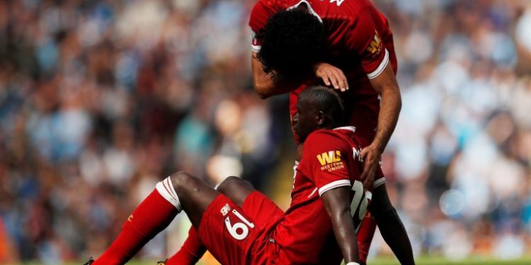 Soccer Football - Premier League - Manchester City vs Liverpool - Manchester, Britain - September 9, 2017   Liverpool's Sadio Mane looks dejected after being sent off as Mohamed Salah looks on   Action Images via Reuters/Lee Smith  EDITORIAL USE ONLY. No use with unauthorized audio, video, data, fixture lists, club/league logos or "live" services. Online in-match use limited to 75 images, no video emulation. No use in betting, games or single club/league/player publications. Please contact your account representative for further details.