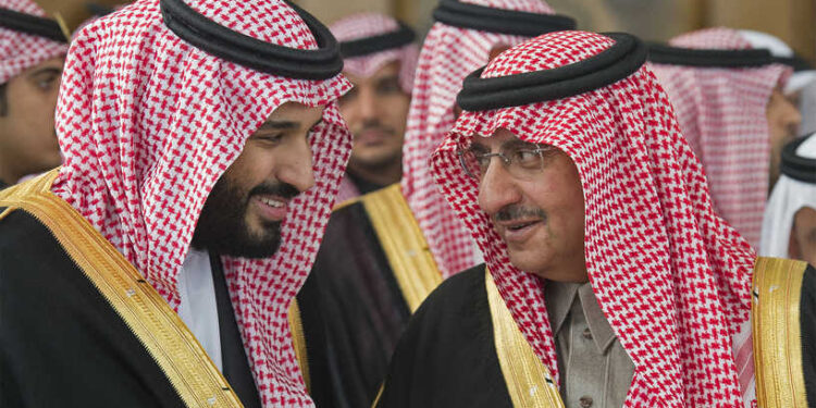 (FILES) In this file handout photo released by Saudi Royal Palace on December 14, 2016 shows Saudi Crown Prince Mohammed bin Nayef (R) speaking with deputy Crown Prince Mohammed bin Salman during the opening session of the Shura Council in Riyadh. - A US-based lawsuit against Saudi Crown Prince Mohammed bin Salman centered on a Caribbean oil refinery, but unexpectedly highlighted something else, the disappearance of his main rival. (Photo by BANDAR AL-JALOUD / Saudi Royal Palace / AFP) / RESTRICTED TO EDITORIAL USE - MANDATORY CREDIT "AFP PHOTO / SAUDI ROYAL PALACE / BANDAR AL-JALOUD" - NO MARKETING - NO ADVERTISING CAMPAIGNS - DISTRIBUTED AS A SERVICE TO CLIENTS
