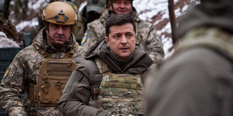 Ukrainian President Volodymyr Zelensky visits combat positions and meets with servicemen at the frontline with Russia-backed separatists in the Donetsk region on the Day of the Armed Forces of Ukraine on December 6, 2021. (Photo by Handout / Ukrainian presidential press-service / AFP) / RESTRICTED TO EDITORIAL USE - MANDATORY CREDIT "AFP PHOTO / Ukrainian presidential press-service / handout " - NO MARKETING - NO ADVERTISING CAMPAIGNS - DISTRIBUTED AS A SERVICE TO CLIENTS