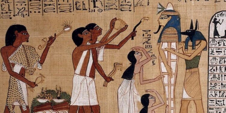بردية من كتاب الموتى تصور الإله أنوبيس يسند مومياء أثناء طقس فتح الفم (الصورة: وكالات)